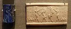 Akkadian Period, lapis lazuli seal with six-eared hero subduing a lion and a water buffalo, from Bismaya, ca. 2350-2150 BC