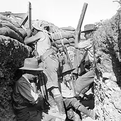 Australian Light Horse troops using a periscope rifle, Gallipoli, 1915. Photograph by Ernest Brooks.