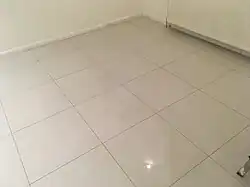 Modern polished porcelain floor tiles in a large format