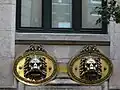 The two lion's head mailboxes