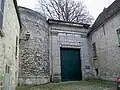 Tower 25, Tour Saint-Maurice, to the left of the western gate of the château garden.