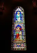 Ulisse De Matteis, Stained-glass window depicting the Assumption of the Virgin and a Guardian Angel, Prato Cathedral, chapel of the Guardian Angels/Assumption, 1871.