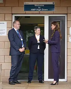 Catherine speaks with authorities outside a men's resettlement prison