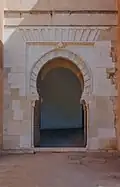 A Moorish architecture gate in Alhambra, Granada, Spain
