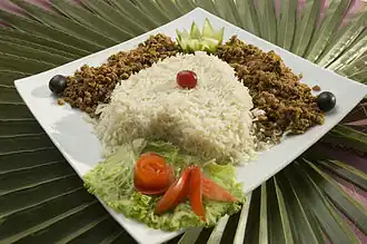 A dish of keema served with cooked rice in Karachi, Pakistan