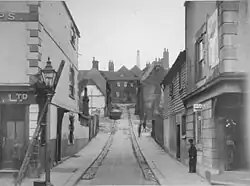 Photograph of Queen Street in Chatham, with the Three Cups pub on the left. The building on the right was a grocer's until 1909, after which it became the Rob Roy.