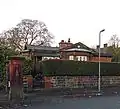 Entrance Lodge too Queen's Drive, Sandfield Park, West Derby (c.1845; grade II)