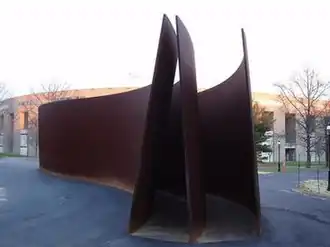 three curved weathering steel plates