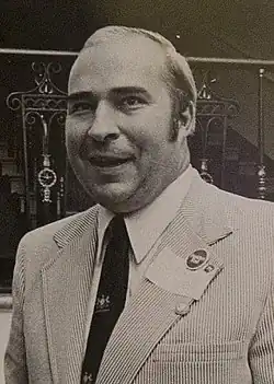 Black-and-white photograph of Dwyer smiling