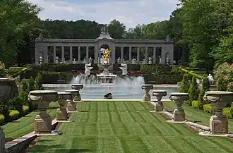 Reflecting pool with gold-plated statue.