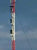 Microwave radio relay antennas on the original mast