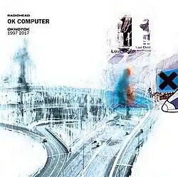 A highly edited image of a highway. In the top-left corner is written "Radiohead", with text beneath reading "OK Computer" and "OKNOTOK 1997 2017".