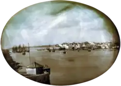 Photograph of various residential and commercial buildings along a waterfront