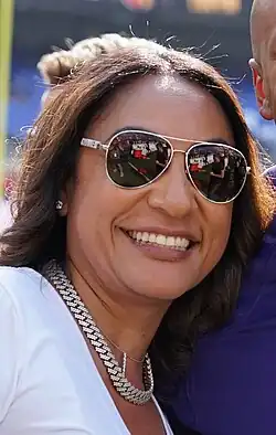 Closeup photo of a Jayden Daniels' mother Regina Jackson smiling in sunglasses