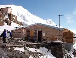 Old Tête Rousse Hut, now dismantled, with the new behind