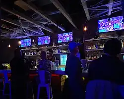 Photo of a bartender pouring a drink