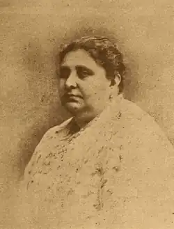 A faded sepia-toned photograph of Rita Cetina Gutiérrez