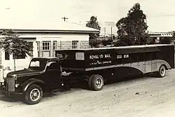 A Tuit vehicle acting as a mail contractor, pictured outside the Alice Springs Post Office, c. 1950s