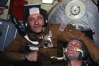 NASA Astronaut Tom Stafford wearing "Snoopy" cap with Plantronics (SPENCOM) headset in 1975 (Apollo-Soyuz Mission)