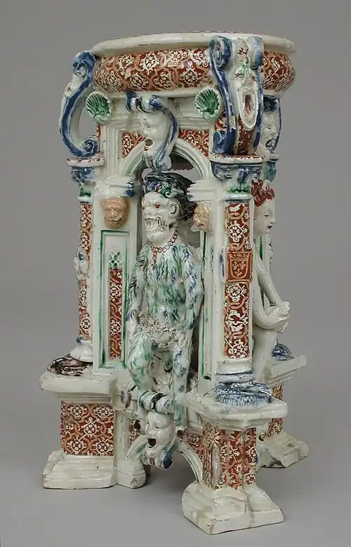 Saint-Porchaire ware, triangular salt, 1540s?, 6 7/8 in. (17.5&nbsp;cm) high, with a (?) satyr, and (?) Venus at right