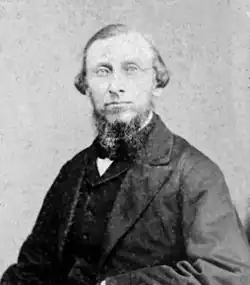 Nineteenth century black-and-white photograph of Samuel Merrill Woodbridge, a man in suit, dress shirt, and tie