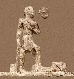 Outline of relief I (extracted). Beardless warrior with axe, trampling a foe. Sundisk above. A name "Zaba(zuna), son of ..." can be read.[63]
