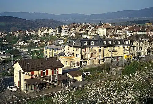 Two-story yellow building with gabled roof