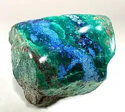 Polished shattuckite with malachite, New Cornelia mine, Ajo, Arizona. Size 5.3 × 5.1 × 5.0&nbsp;cm