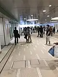 The new north–south corridor of Shin-Koiwa Station on the Sobu Line in Tokyo, opened on 24 June 2018 allows people to walk from the north entrance to the south entrance without walking around the station building. This view is towards the north exit.