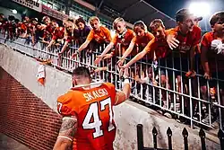 Young fans loving Skalski as he exists Memorial Stadium after defeating Georgia Tech 14–8, 2021.
