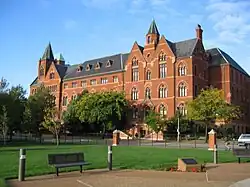 Photograph of DuBourg Hall behind a grass field