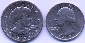 Two coins being shown together as a comparison of their size