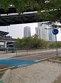 Bike crossing with sign and blue route at northern part of Southwest Dedicated Bicycle Highway, located near POS Malaysia headquarter.