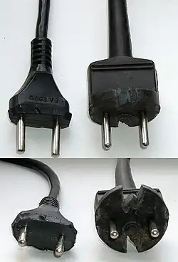 Moulded rubber Soviet plugs cut with knife so that they can fit into CEE&nbsp;7/3 socket. Originally the plugs had a round base.