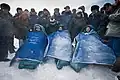 Kaleri, Skripochka and Kelly sit in chairs after they landed.