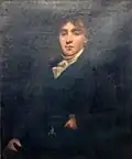 A painting hanging in the hallway of the house.