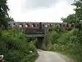 Train crossing the bridge over the lane