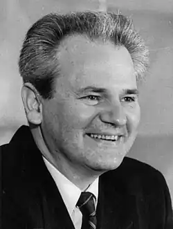 Slobodan Milošević pictured smiling in the National Assembly of Serbia