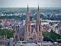 The church's twin spires rising high above their surrounding