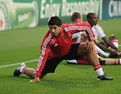 Football player Luis Suárez stretching prior to a match.