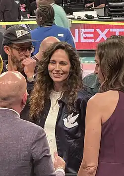 Sue Bird greets the ESPN broadcast team after a WNBA Playoffs game between the New York Liberty and the Atlanta Dream in 2024