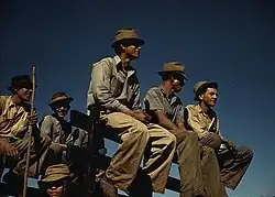 Image 12Sugar cane workers resting at the noon hour, Rio Piedras. Photograph by Jack Delano, a photographer for the Farm Security Administration. Ca. 1941. (from History of Puerto Rico)