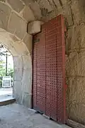 Door, photographed from within the gate