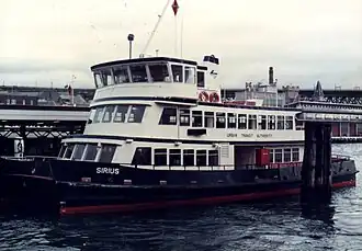 Sirius (1984), the first of nine "First Fleet-class" ferries in her original blue and white livery