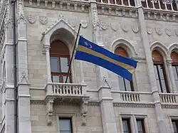 Székely flag flying above the Hungarian Parliament Building, Budapest