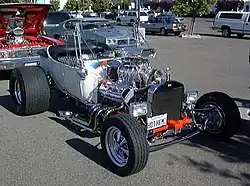 T-bucket with early hemi, but aluminum radiator (rather than brass), rectangular headlights, and five-spokes (rather than motorcycle wheels) mark this as a later incarnation