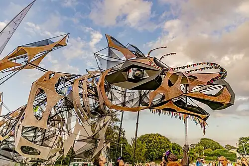 The Hatchling as a rod puppet, in procession, by Damian Pudner 2021