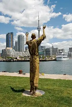 Migrants (bronze), 2007, Ireland Park, Toronto Harbourfront. The Jubilant Man stands 320&nbsp;cm tall.