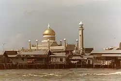 View of the stilt houses in Kampong Sultan Lama and the Omar Ali Saifuddien Mosque from the Brunei River in 1985