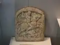 Thracian horseman attacking a lion which is in turn attacking its prey. Madara Museum, Bulgaria